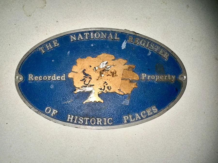 The enamel National Register of Historic Places marker